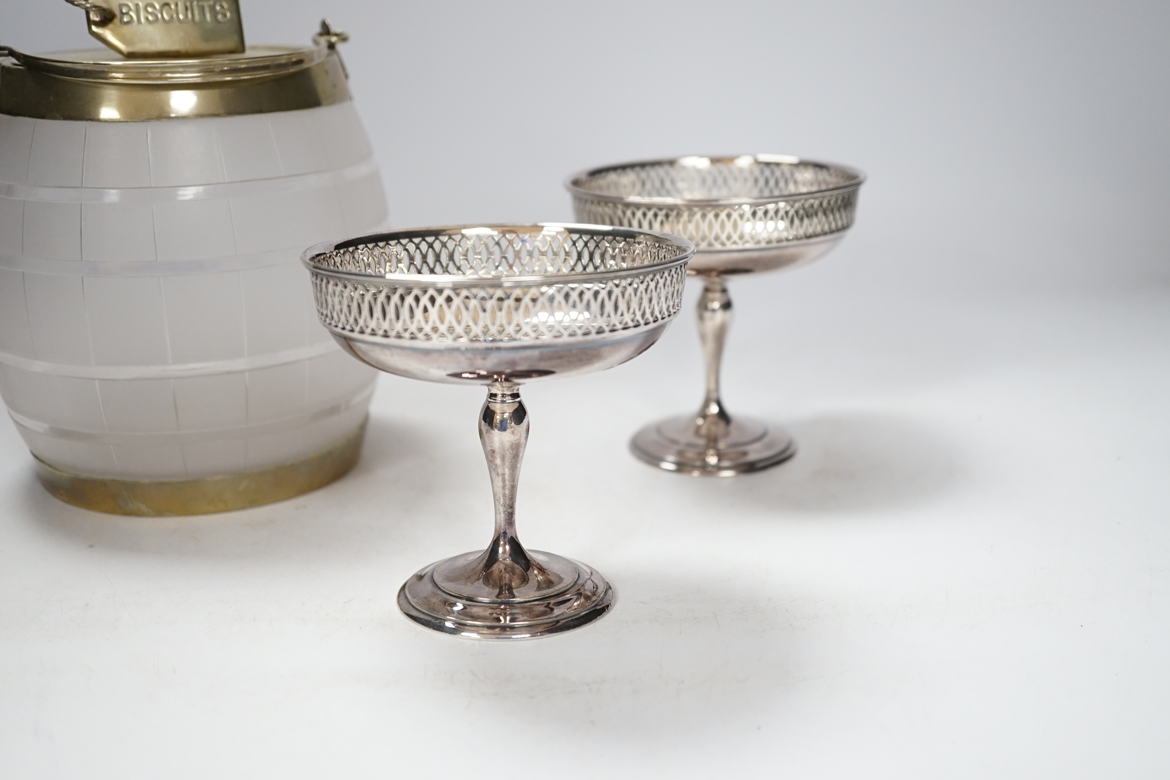 A vintage frosted glass 'BISCUIT' barrel with plated mounts, the cover with 'coiled rope' finial, impressed 'Whiteleys, Westbourne Grove' together with two small sweetmeat tazzas, tallest 17cm